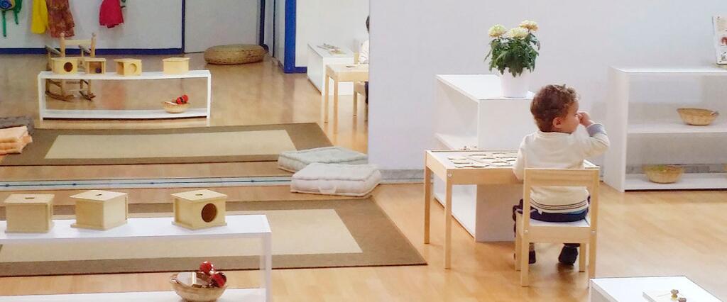 How does the Montessori Infant Community classroom differ from traditional early childhood education settings?